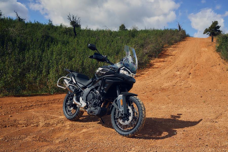2025-on CF Moto 700MT - static shot of the 700MT on a dusty red trail